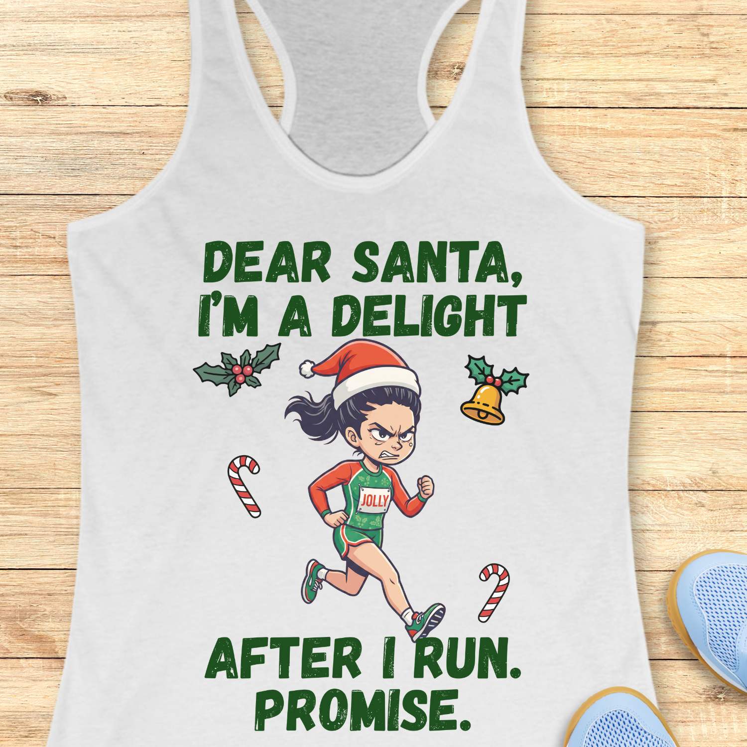 white racerback tank top displayed on a light wooden surface, featuring a festive running-themed graphic. The design shows a cartoon runner wearing a Santa hat, green running outfit with the word “JOLLY” on the chest, and running shoes. Holiday elements including holly leaves, a Christmas bell, and candy canes surround the runner. Bold green text above and below the illustration reads: “DEAR SANTA, I’M A DELIGHT” and “AFTER I RUN. PROMISE.” Partial blue athletic shoes are visible in the lower corner