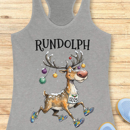 Heather gray racerback tank top featuring the word “RUNDOLPH” above a playful cartoon reindeer running in colorful athletic shoes. The reindeer has snow-dusted antlers decorated with hanging Christmas ornaments and wears a race bib displaying “12/25.” Snowflakes are scattered throughout the design, adding a festive winter feel. The humorous artwork combines holiday cheer and running culture, making it perfect for runners who love Christmas-themed race apparel.