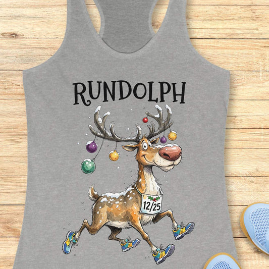 Heather gray racerback tank top featuring the word “RUNDOLPH” above a playful cartoon reindeer running in colorful athletic shoes. The reindeer has snow-dusted antlers decorated with hanging Christmas ornaments and wears a race bib displaying “12/25.” Snowflakes are scattered throughout the design, adding a festive winter feel. The humorous artwork combines holiday cheer and running culture, making it perfect for runners who love Christmas-themed race apparel.