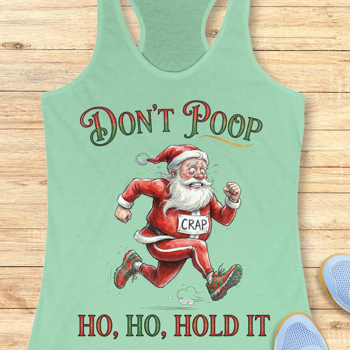 mint racerback tank top featuring the funny Christmas running phrase “DON’T POOP HO, HO, HOLD IT” in festive red and green lettering. The design shows a cartoon Santa Claus running urgently in athletic shoes while wearing a race bib labeled “CRAP.” Santa appears mid-stride with a humorous expression, creating a playful nod to the well-known runner's struggle of finding a bathroom during a race. This lighthearted holiday running design is perfect for runners who appreciate race-day humor and Christmas-theme