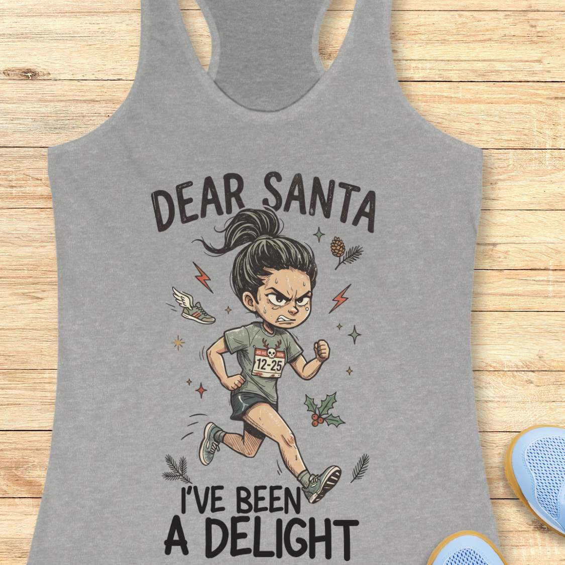 grey racerback tank top featuring the humorous Christmas running phrase “DEAR SANTA I’VE BEEN A DELIGHT” in bold black lettering. The design includes a cartoon runner wearing a race bib marked “12-25,” surrounded by holiday accents such as holly leaves, pine sprigs, stars, and a winged running shoe. The festive artwork combines runner humor with Christmas cheer. The tank top is displayed on a light wood background with partial blue running shoes visible in the corners.