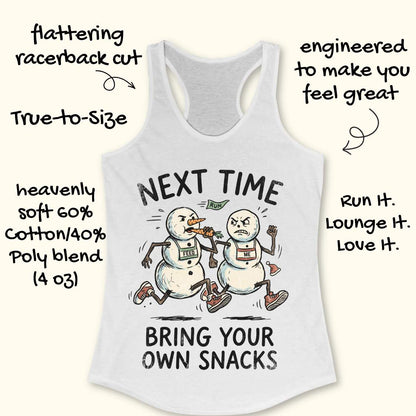 A white racerback tank top with a humorous snowman graphic and text reading 'NEXT TIME BRING YOUR OWN SNACKS,' shown on a light beige background with decorative callout text around it.