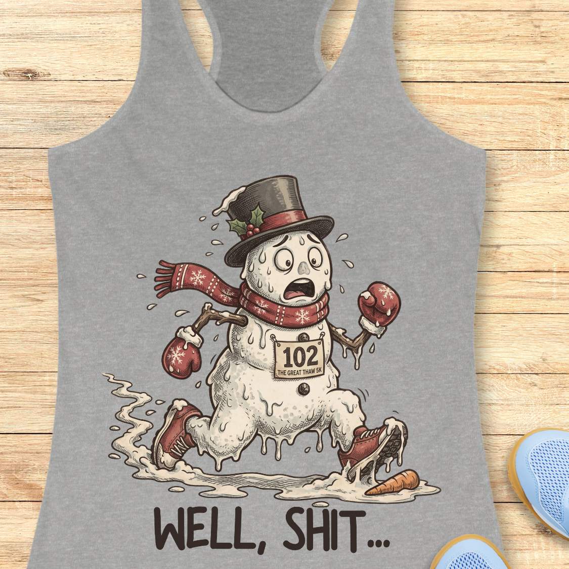 Funny Christmas running tank top featuring a melting snowman runner wearing red running shoes, boxing gloves, a scarf, and a top hat. The snowman has a race bib labeled "102 The Great Thaw 5K" and is shown melting while running through puddles, with a carrot nose fallen on the ground ahead. Large text below reads, "WELL, SHIT..." The design is printed on a heather gray racerback tank top and combines holiday humor with runner frustration.