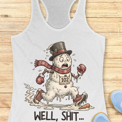 Funny Christmas running white tank top featuring a melting snowman runner wearing red running shoes, boxing gloves, a scarf, and a top hat. The snowman has a race bib labeled "102 The Great Thaw 5K" and is shown melting while running through puddles, with a carrot nose fallen on the ground ahead. Large text below reads, "WELL, SHIT..." The design is printed on a heather gray racerback tank top and combines holiday humor with runner frustration.
