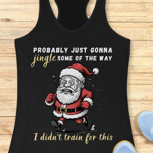 A black racerback tank top laid flat on a light wood background, featuring a humorous graphic of a running Santa Claus with the text 'PROBABLY JUST GONNA jingle SOME OF THE WAY I didn't train for this'.