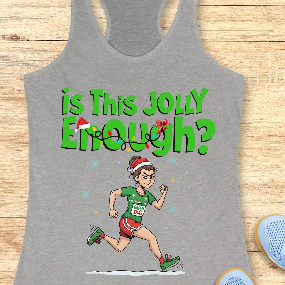 Graphic design on a grey tank top depicting a determined cartoon woman in a Santa hat running a Christmas race, wearing a green shirt with a GREEN XMAS bib, red shorts, and green shoes, below the text Is This Jolly Enough adorned with festive lights and a tiny Santa hat