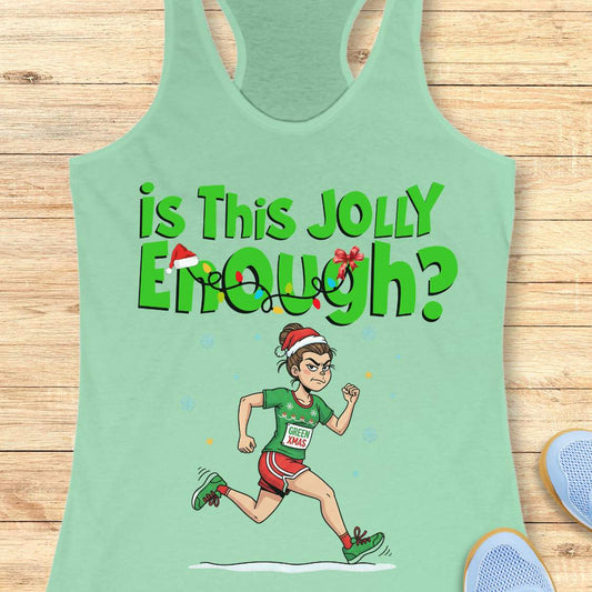 Graphic design on a mint green tank top depicting a determined cartoon woman in a Santa hat running a Christmas race, wearing a green shirt with a GREEN XMAS bib, red shorts, and green shoes, below the text Is This Jolly Enough adorned with festive lights and a tiny Santa hat