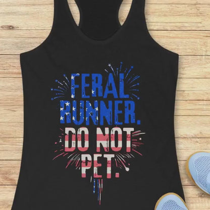 A video of a Black tank top with the text - feral runner. do not pet. with the American flag colors and design. Wooden background